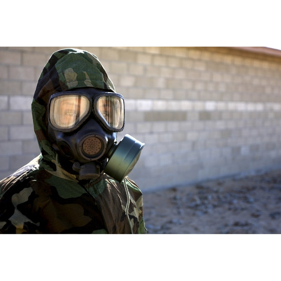 A Marine wearing a gas mask after completion of the confidence chamber Poster Print Image 1