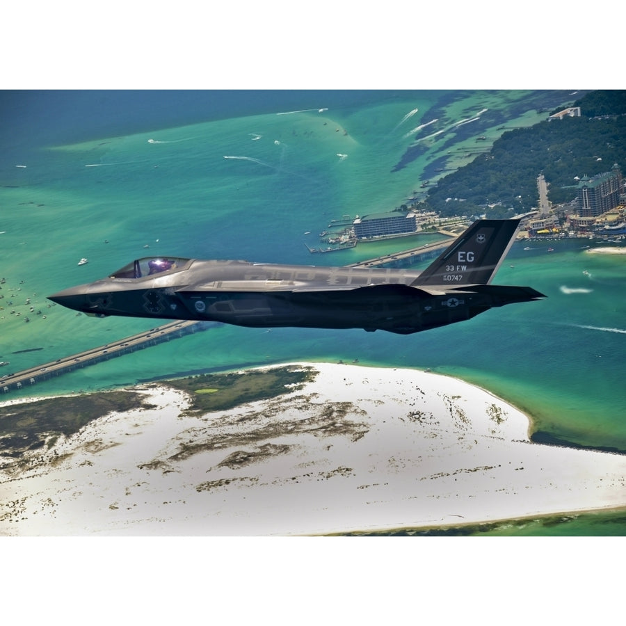 An F-35 Lightning II flies over Destin Florida Poster Print Image 1