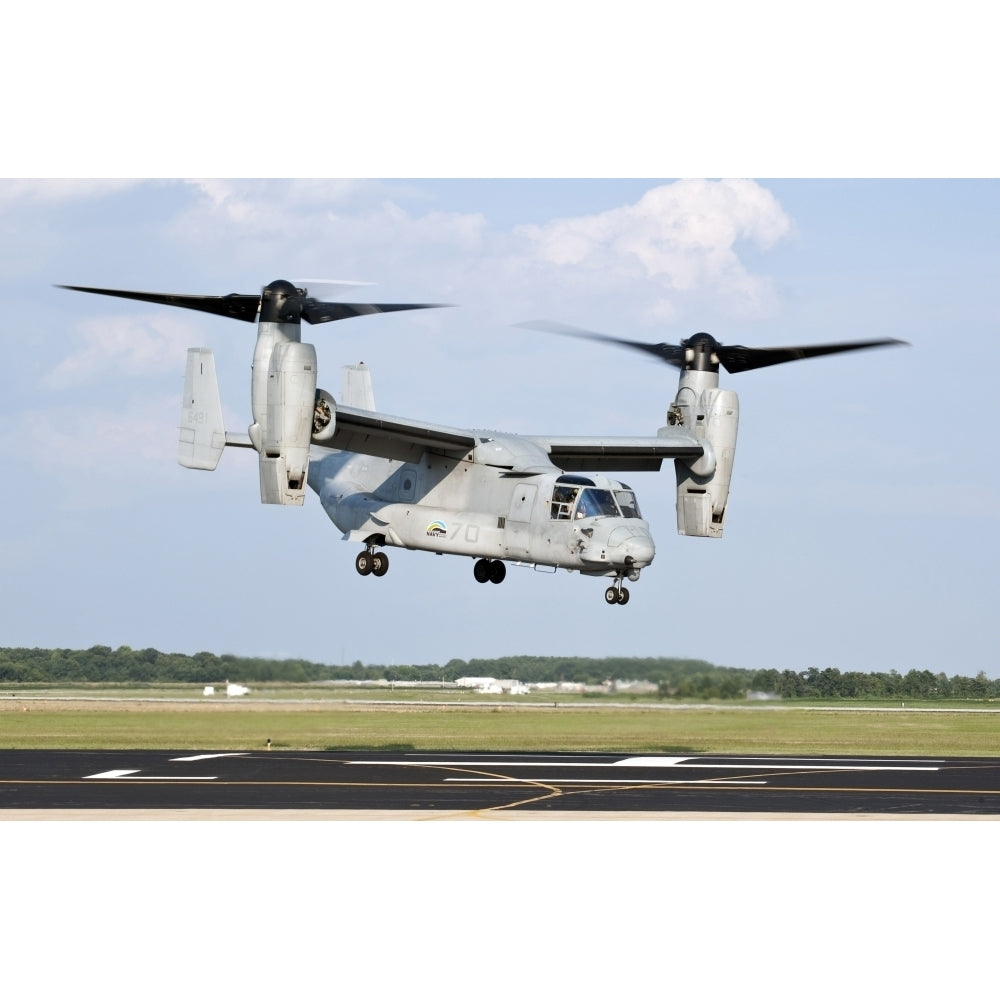 A U.S. Marine Corps MV-22 Osprey lifts off during a successful biofuel test flight Poster Print Image 1