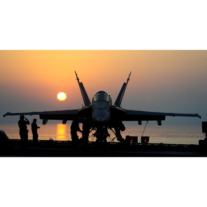 Sailors prepare an F/A-18C Hornet for flight operations aboard USS John C. Stennis Poster Print Image 1