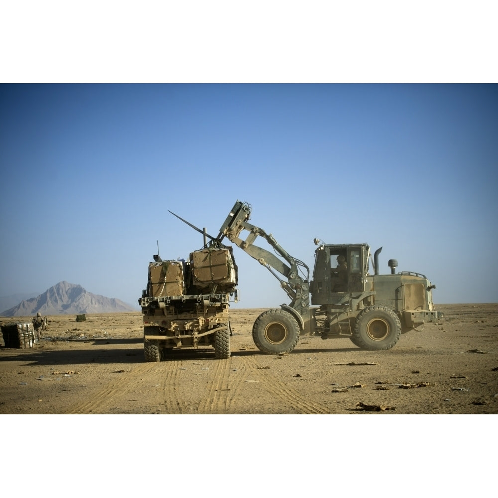 Pallets of food rations are loaded onto a truck Poster Print Image 1