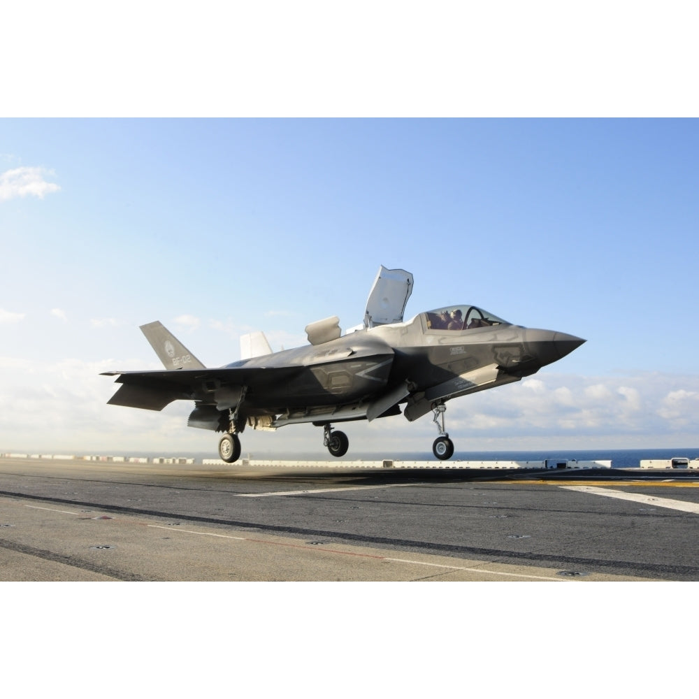 An F-35B Lightning II lifts off the flight deck of USS Wasp Poster Print Image 1