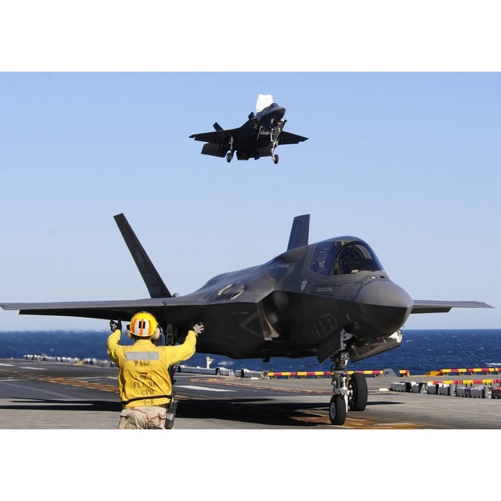 F-35B Lighnting II variants land aboard the flight deck of USS Wasp Poster Print Image 1