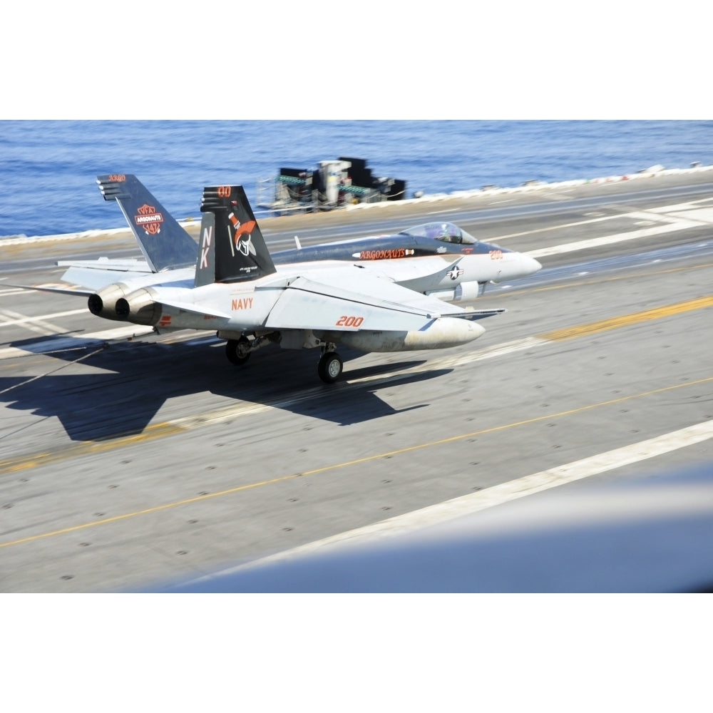 An F/A-18E Super Hornet lands aboard the aircraft carrier USS Ronald Reagan Poster Print Image 2