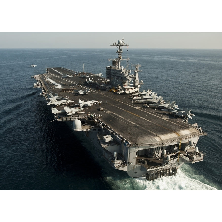 The Nimitz-class aircraft carrier USS John C. Stennis transits the Arabian Sea Poster Print Image 1