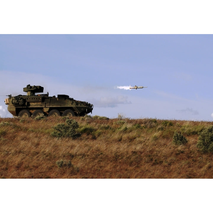 A TOW missile is launched from an armored vehicle Poster Print Image 1