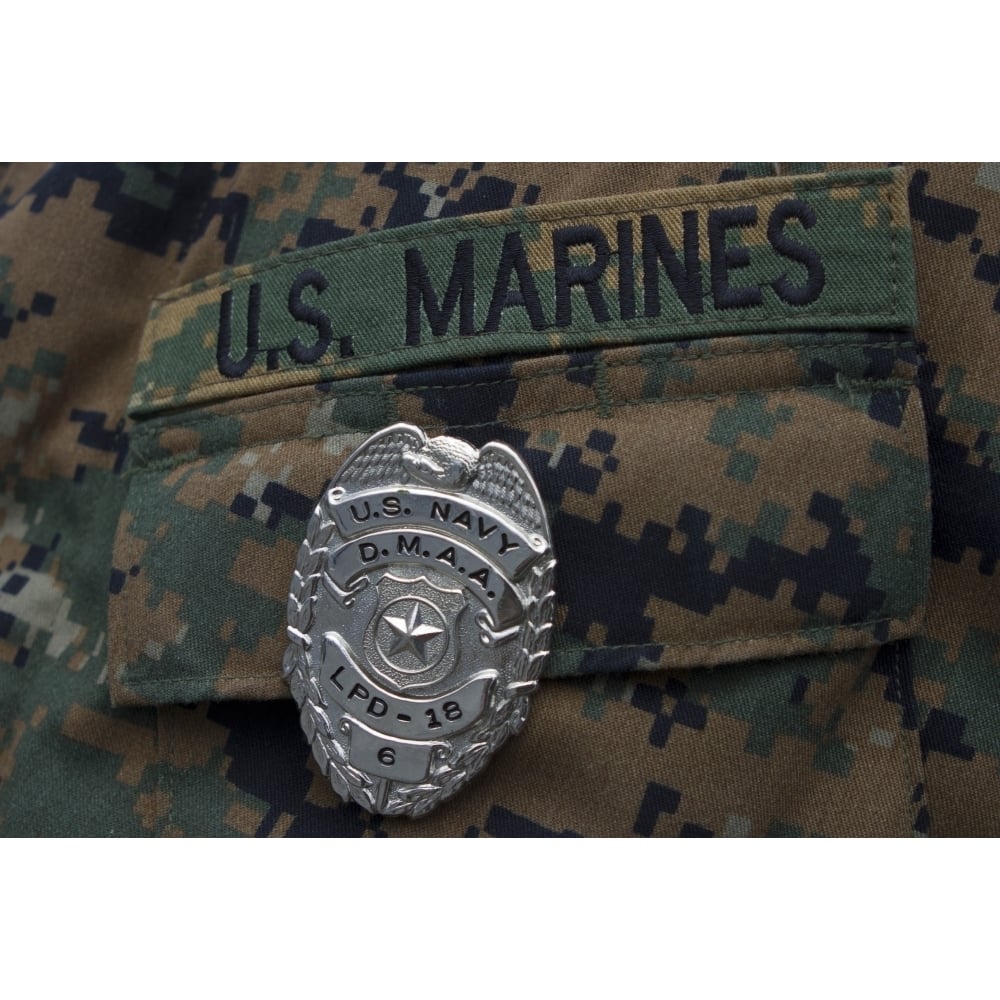 Close-up of a duty master-at-arms badge on the uniform of a U.S. Marine Poster Print Image 1