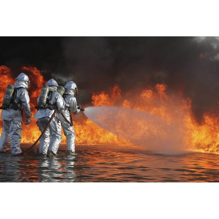 Firefighting Marines battle a huge blaze Poster Print Image 1