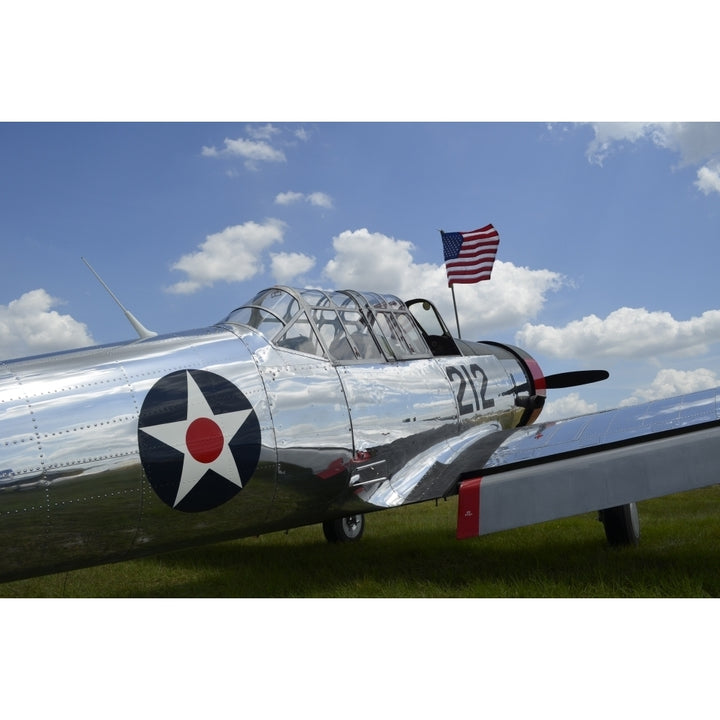 A BT-13 Valiant trainer aircraft with American Flag Poster Print Image 2