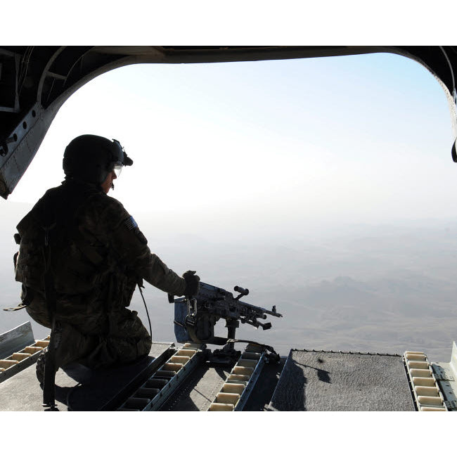 A US Army soldier scans the area in the back of a CH-47 Chinook over Afghanistan Poster Print by Stocktrek Images Image 2