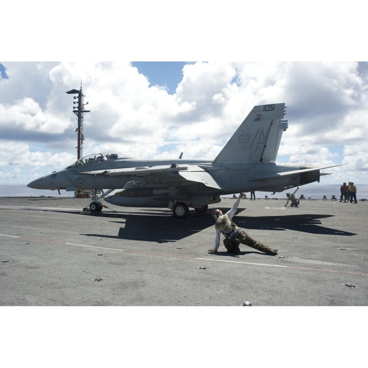 Shooters give the signal to launch an F/A-18E Super Hornet Poster Print Image 1