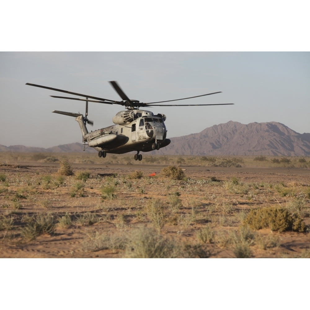 A U.S. Marine Corps CH-53 Sea Stallion helicopter lands to pick up Marines Poster Print Image 2