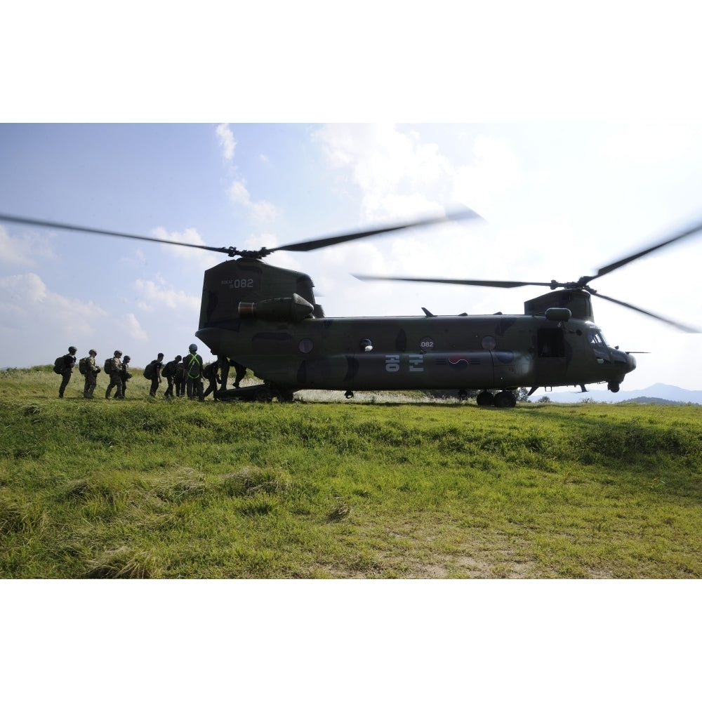 Soldiers board a Republic of Korea Air Force CH-47 Chinook helicopter Poster Print Image 2