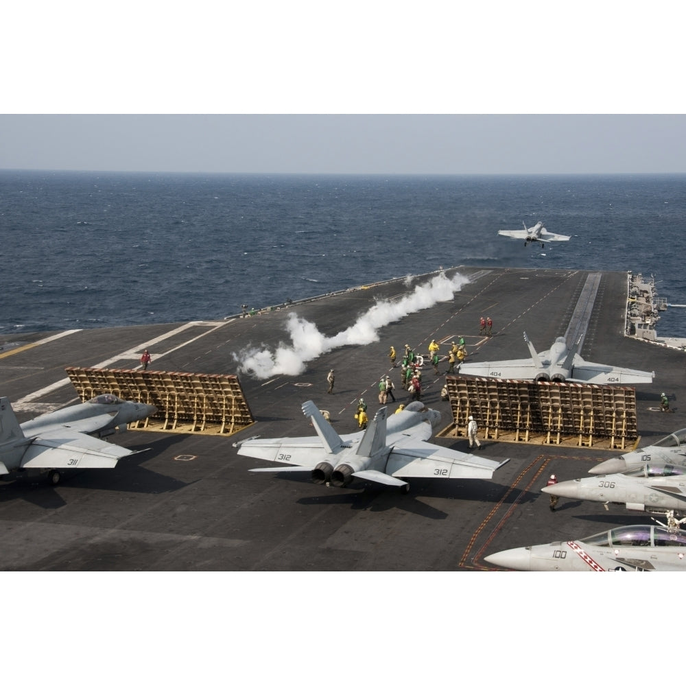 An F/A-18 Hornet launches from the aircraft carrier USS George Washington Poster Print Image 2