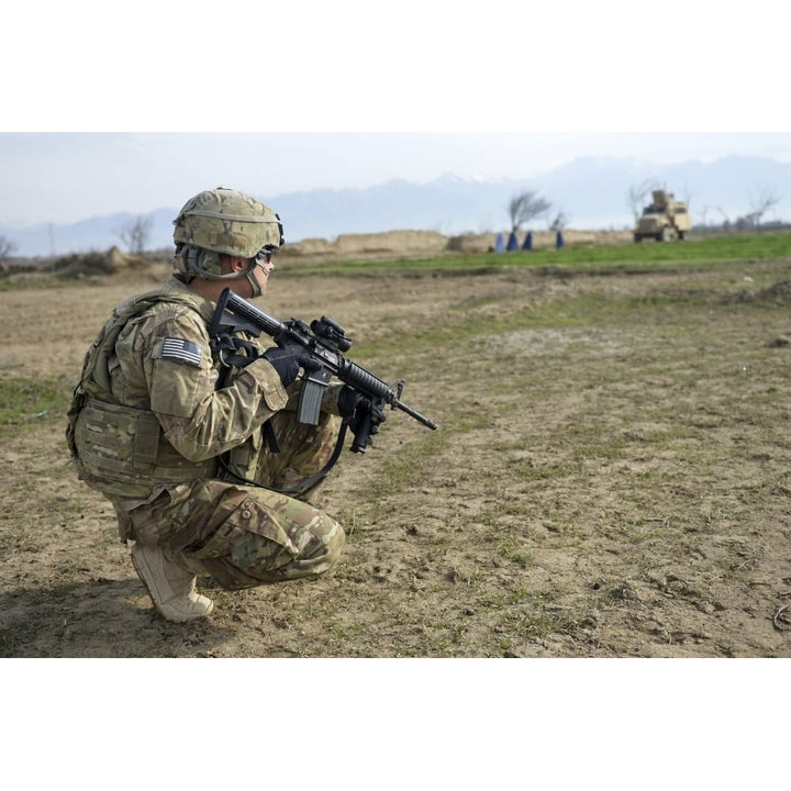 U.S. Soldier patrols a village in Afghanistan Poster Print Image 1