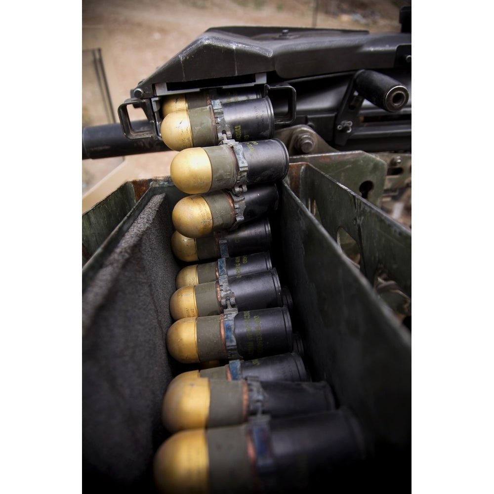 Linked 40mm rounds feed into a Mark 19 grenade launcher Poster Print Image 2