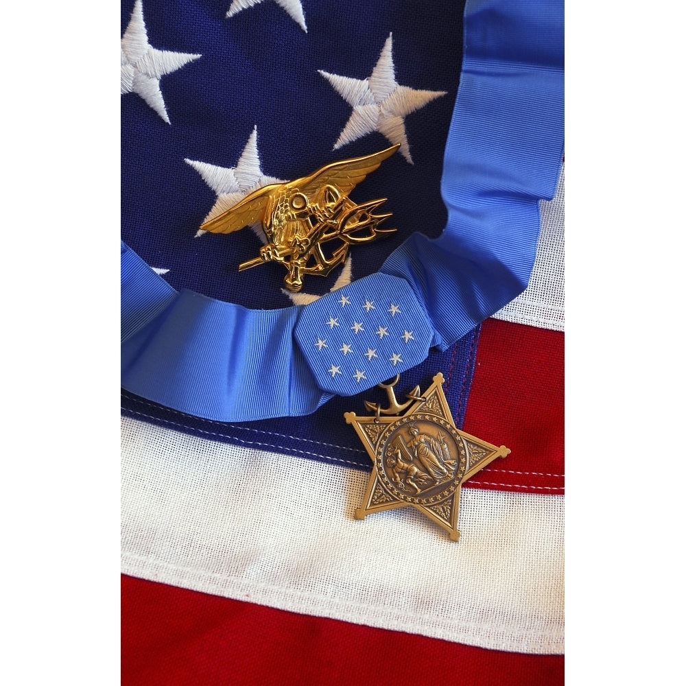 The Medal of Honor rests on a flag beside a SEAL trident Poster Print Image 2