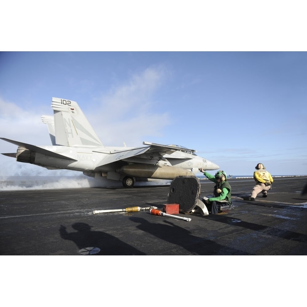 An F/A-18F Super Hornet launches from USS Nimitz Poster Print Image 1