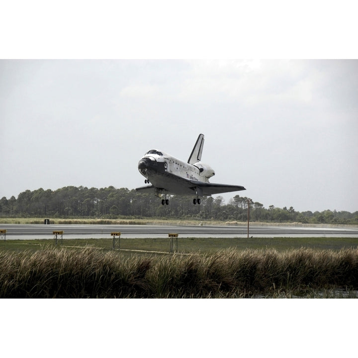 Space Shuttle Discovery approaches landing on the runway at the Kennedy Space Center Poster Print Image 1