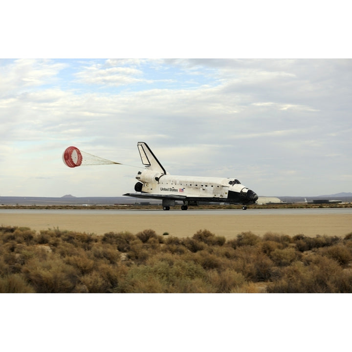 Space Shuttle Discovery deploys its drag chute as the vehicle comes to a stop Poster Print Image 2