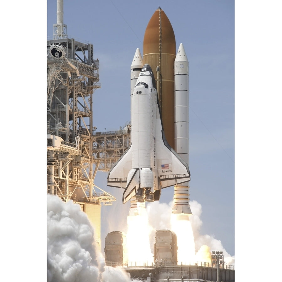 Space shuttle Atlantis twin solid rocket boosters ignite to propel spacecraft Kennedy Space Centers Launch Pad 39A Image 1