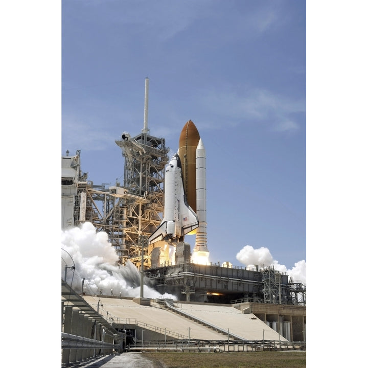 Space shuttle Atlantis twin solid rocket boosters ignite to propel spacecraft Kennedy Space Centers Launch Pad 39A Image 1