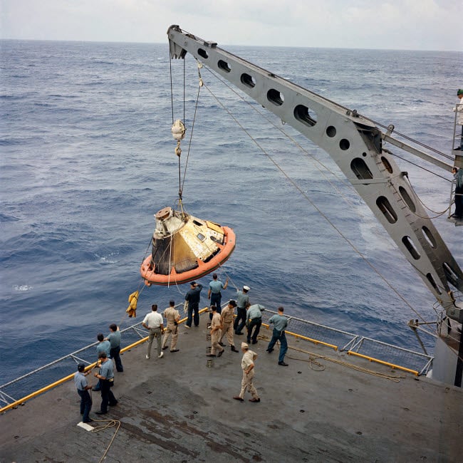 The Apollo Spacecraft command module is recovered aboard USS Bennington Poster Print by Stocktrek Images Image 1