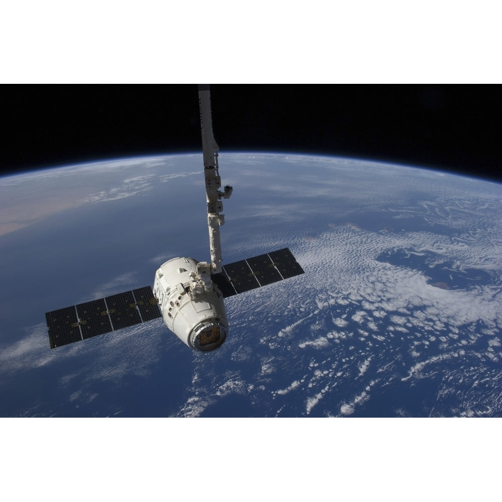 The SpaceX Dragon cargo craft prior to being released by the Canadarm2 robotic arm Poster Print Image 2