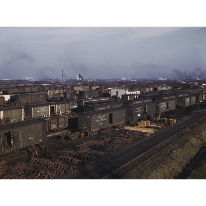 Freight cars being maneuvered in a Chicago and Northwestern railroad yard. Poster Print by Stocktrek Images Image 2