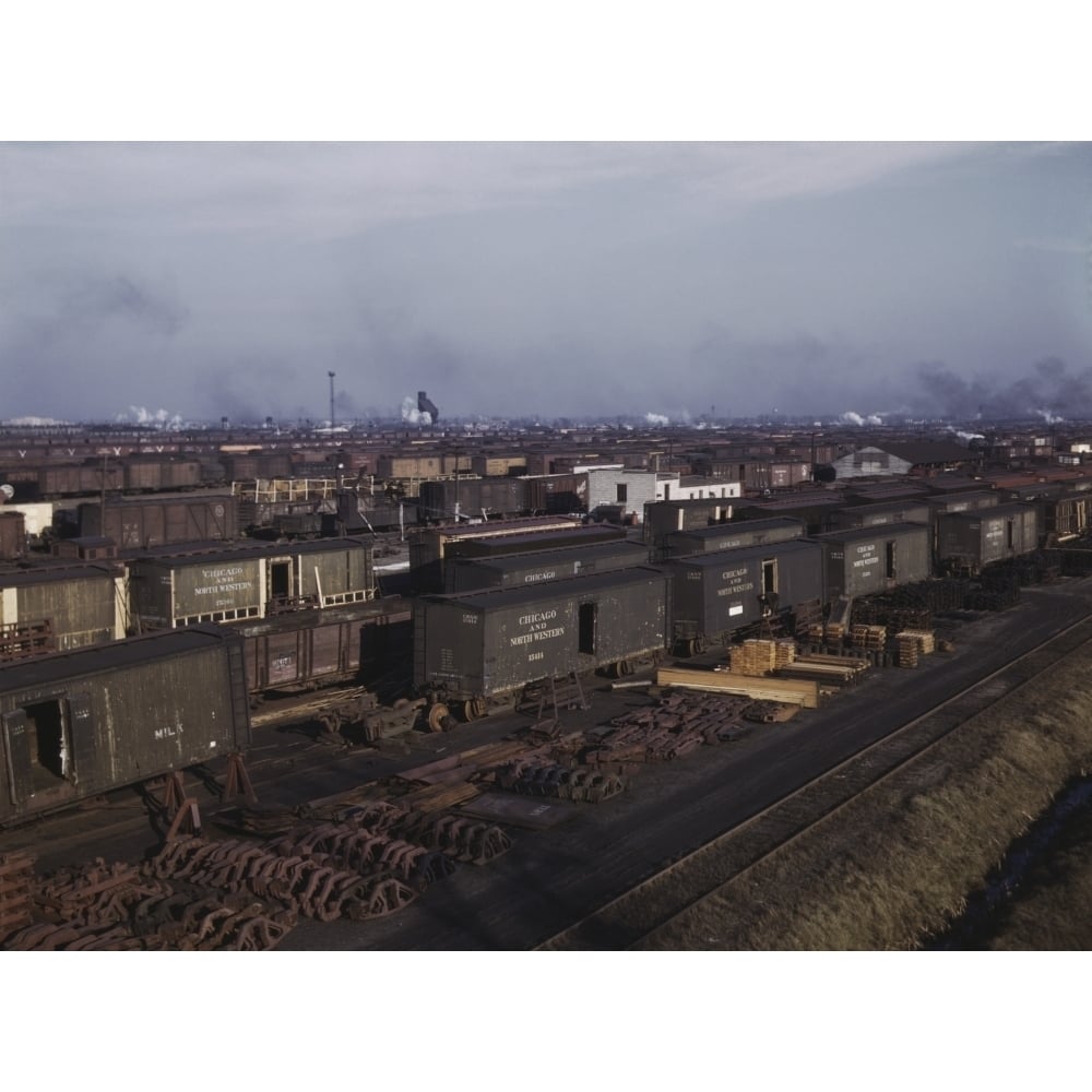 Freight cars being maneuvered in a Chicago and Northwestern railroad yard. Poster Print by Stocktrek Images Image 1