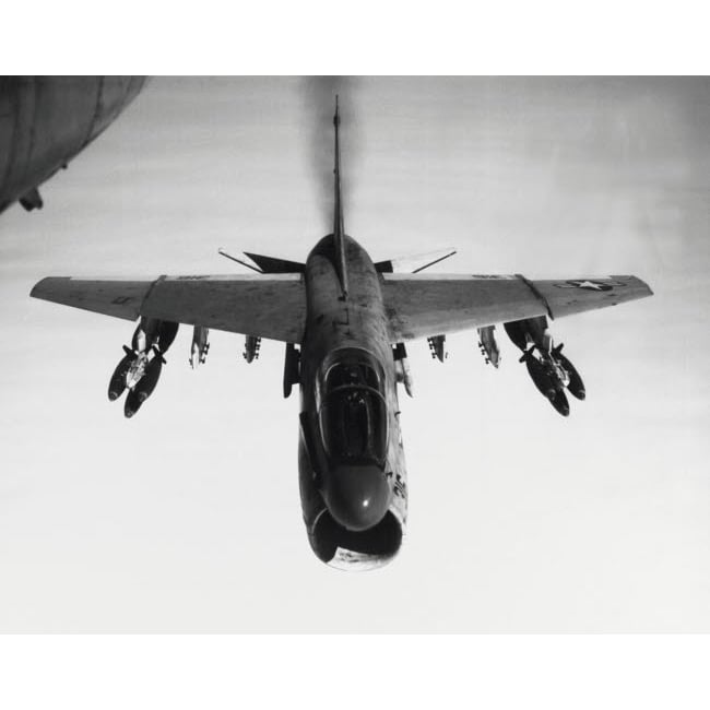 An A-7 Corsair II flies toward targets in Vietnam armed with bomb clusters 1969 Poster Print by Stocktrek Images Image 1