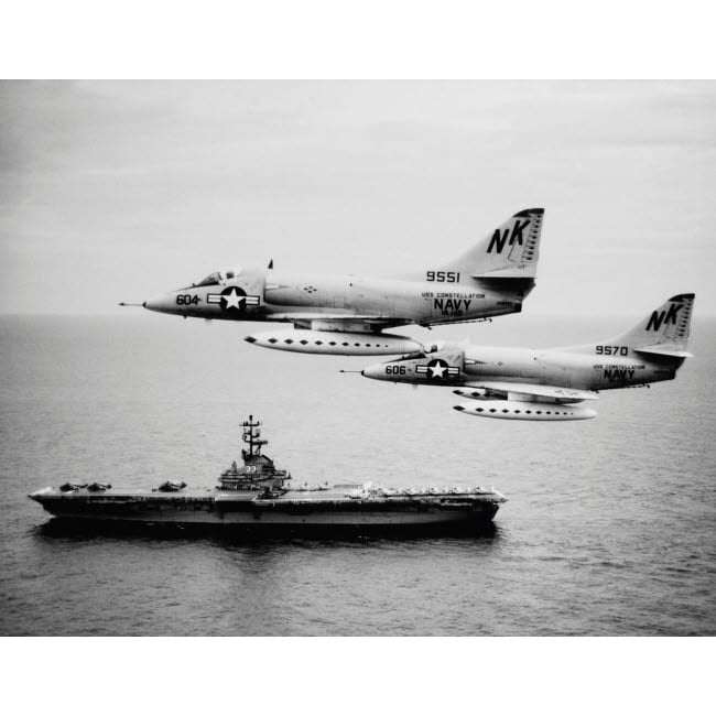 Two A-4C Skyhawk aircraft fly past anti-submarine aircraft carrier USS Kearsarge 1964 Poster Print by Stocktrek Images Image 1