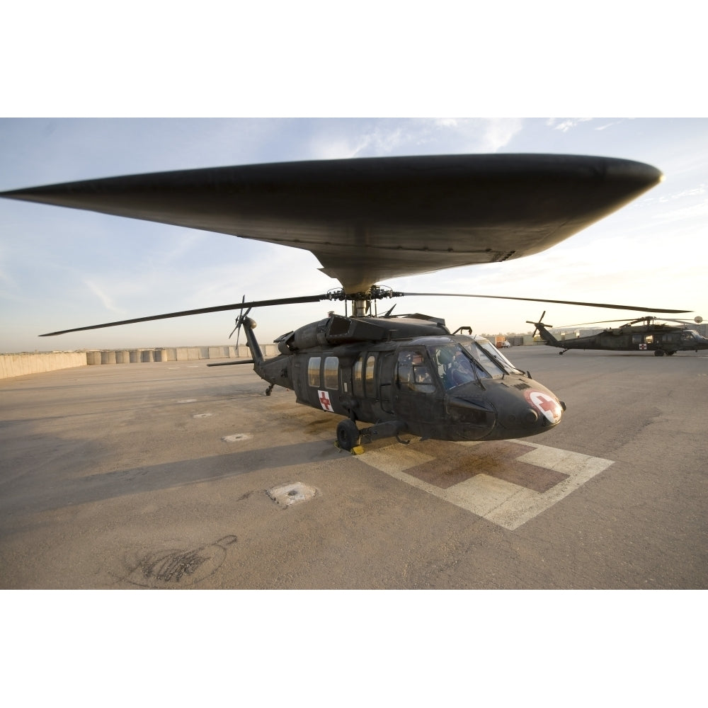 A UH-60 Blackhawk Medivac helicopter sits on the flight deck at Camp Warhorse Poster Print Image 2