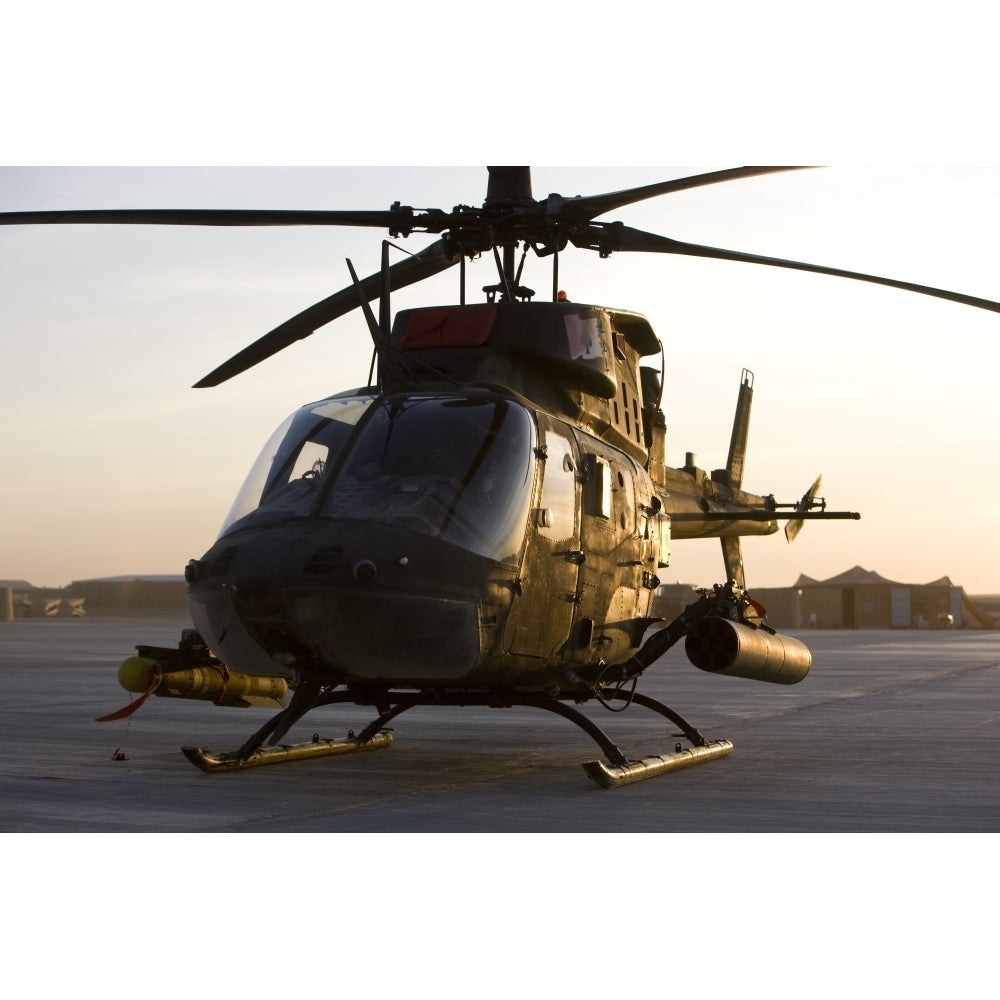 An OH-58D Kiowa during sunset Poster Print Image 2