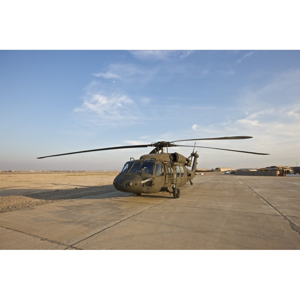 A UH-60 Black Hawk parked at a military base in Tikrit Iraq Poster Print Image 2