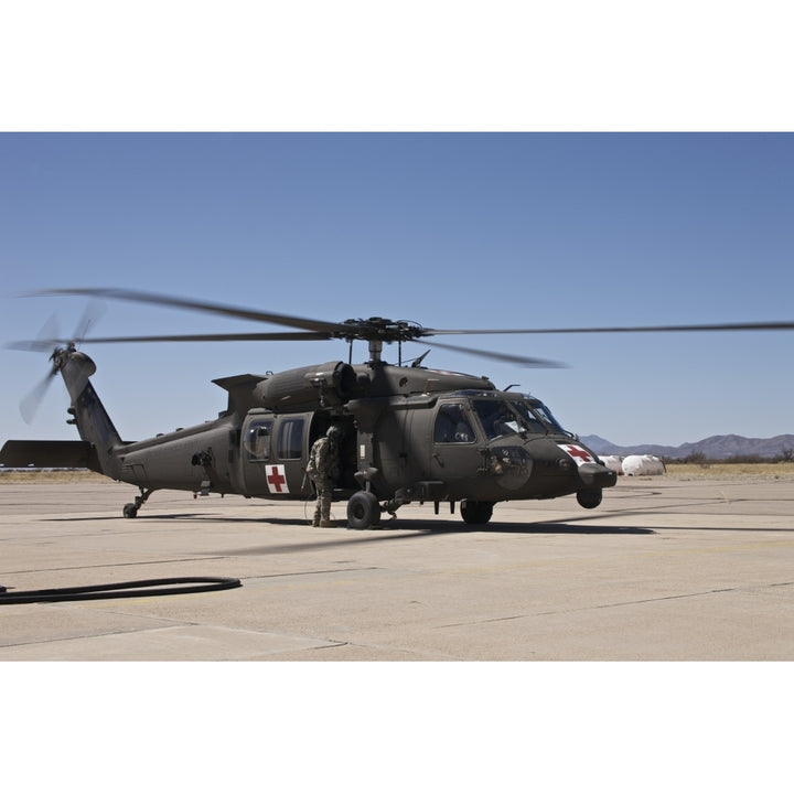 A UH-60 Blackhawk helicopter at Davis-Monthan Air Force Base Poster Print Image 1