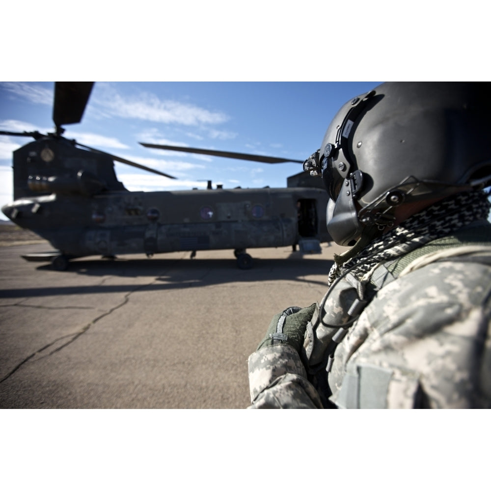 Crew chief of a CH-47 Chinook stands outside the aircraft Poster Print Image 2