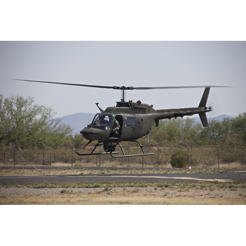 An OH-58 Kiowa helicopter of the U.S. Army landing at Pinal Airpark Arizona Poster Print Image 2