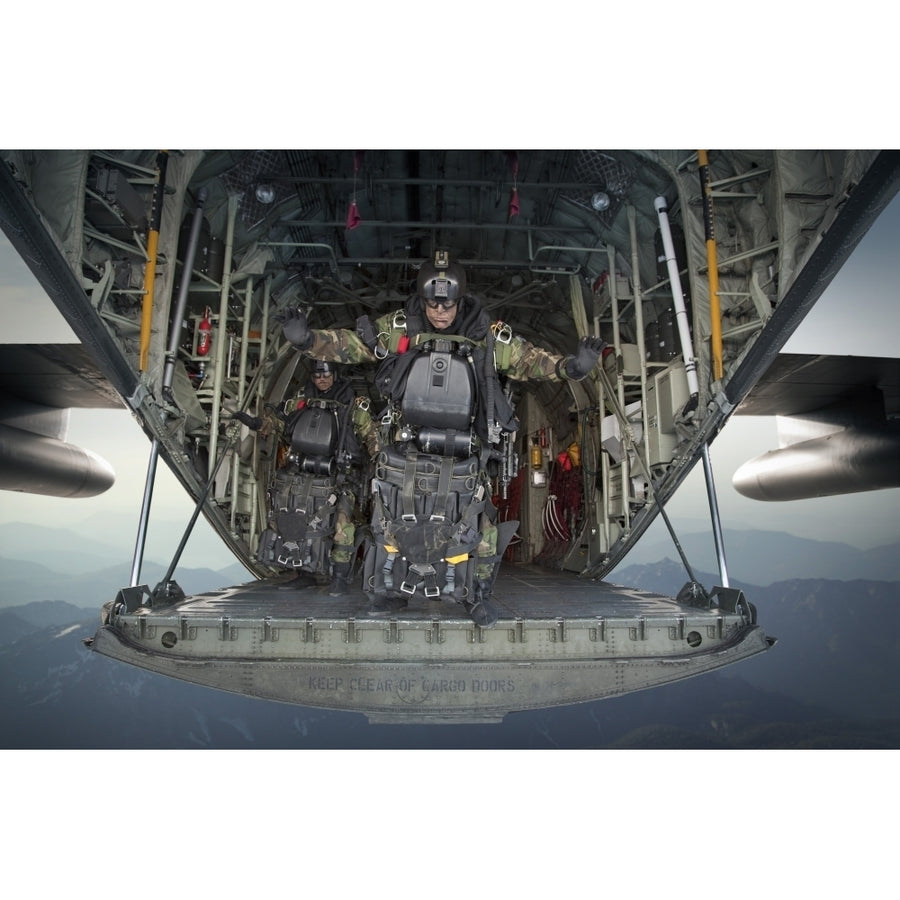 U.S. Navy SEALs combat diver prepares for HALO jump operations from a C-130 Hercules Poster Print Image 1