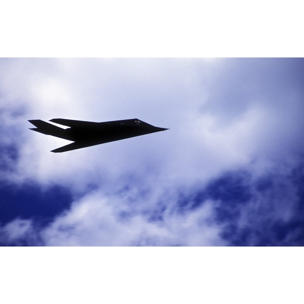 The F-117A Nighthawk climbs into the clouds during a Rim of the Pacific exercise Poster Print Image 1