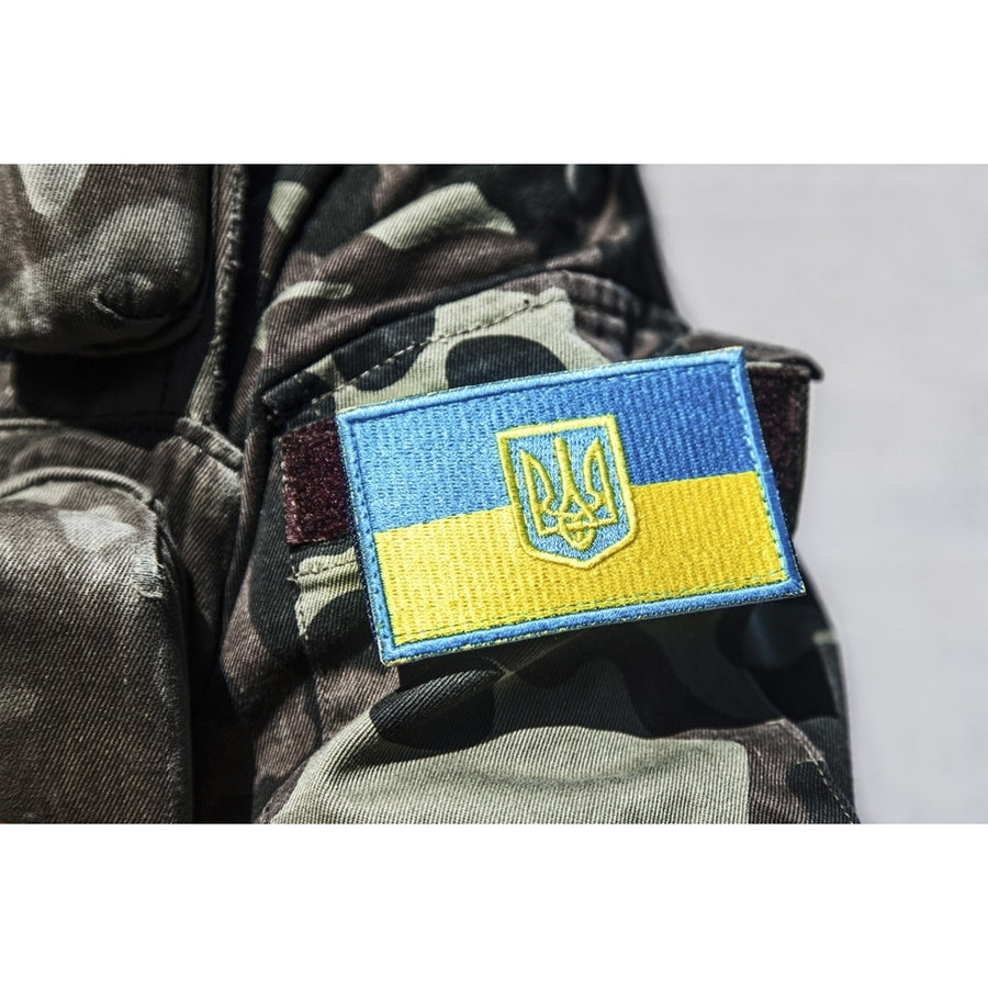 Military badge of Ukrainian Army with trident and yellow-blue flag. Poster Print by Oleg Zabielin/Stocktrek Images Image 1