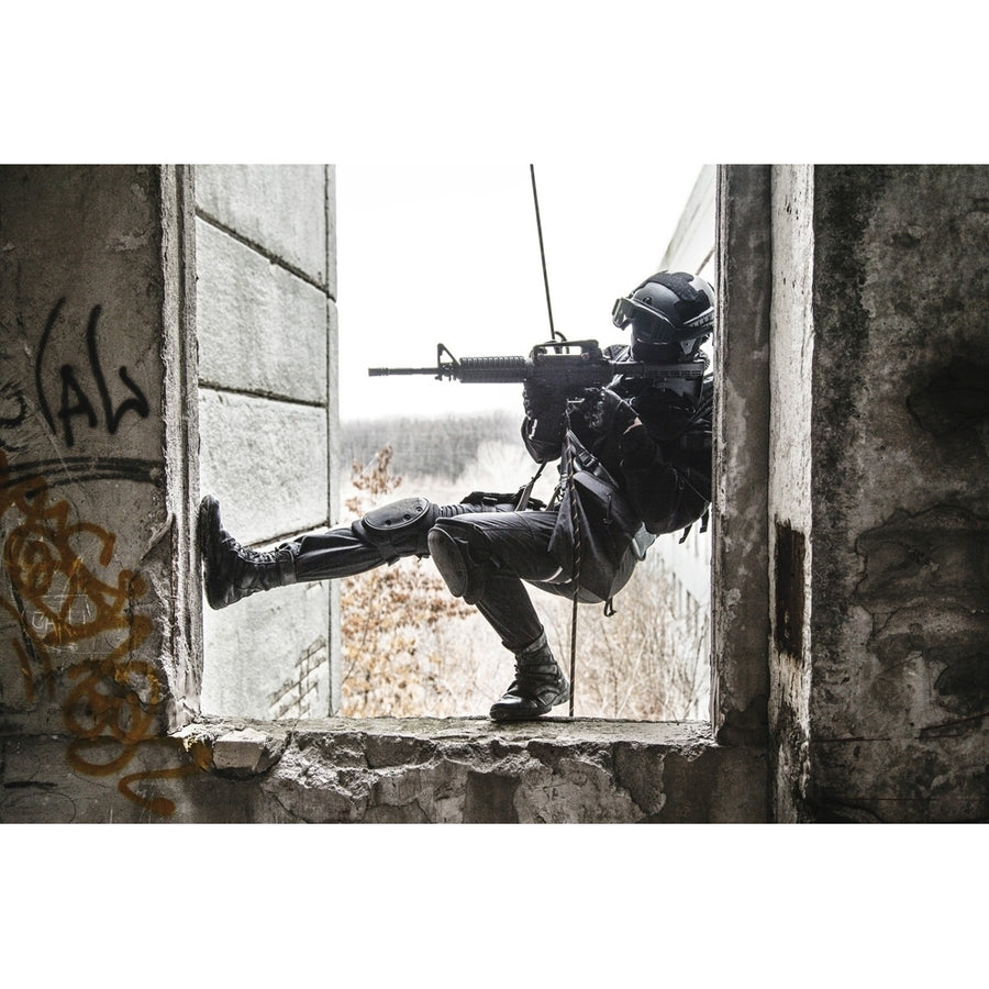 Spec ops police officer SWAT during rope exercises with weapons. Poster Print by Oleg Zabielin/Stocktrek Images Image 1