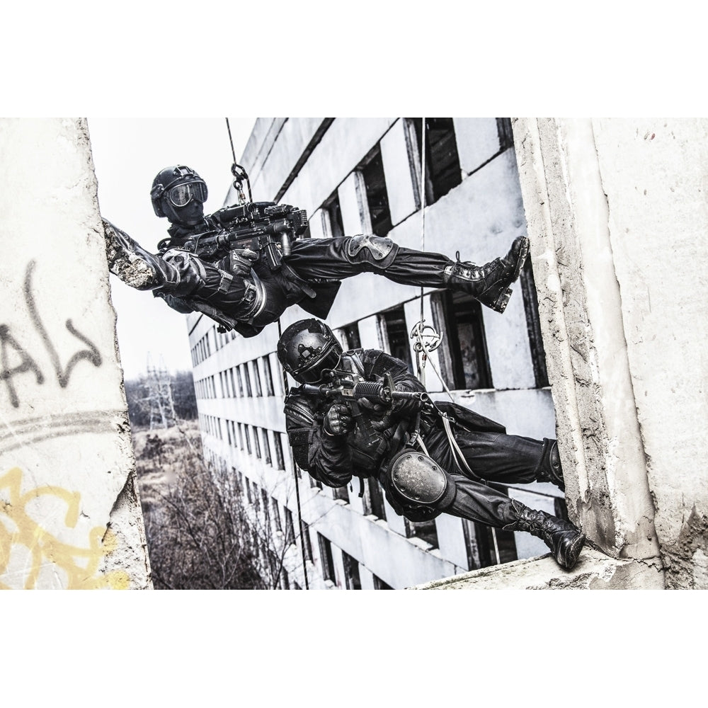 Spec ops police officers SWAT during rope exercises with weapons. Poster Print by Oleg Zabielin/Stocktrek Images Image 1