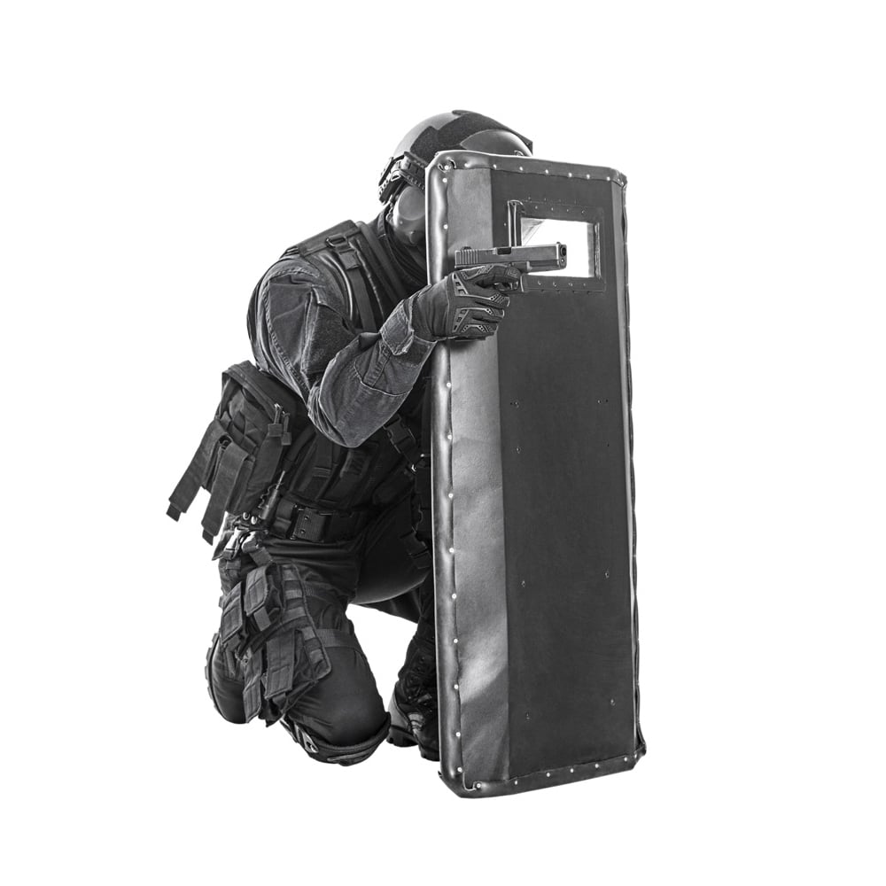 Studio shot of SWAT police special forces with pistol kneeling behind ballistic shield. Poster Print by Oleg Zabielin/S Image 1