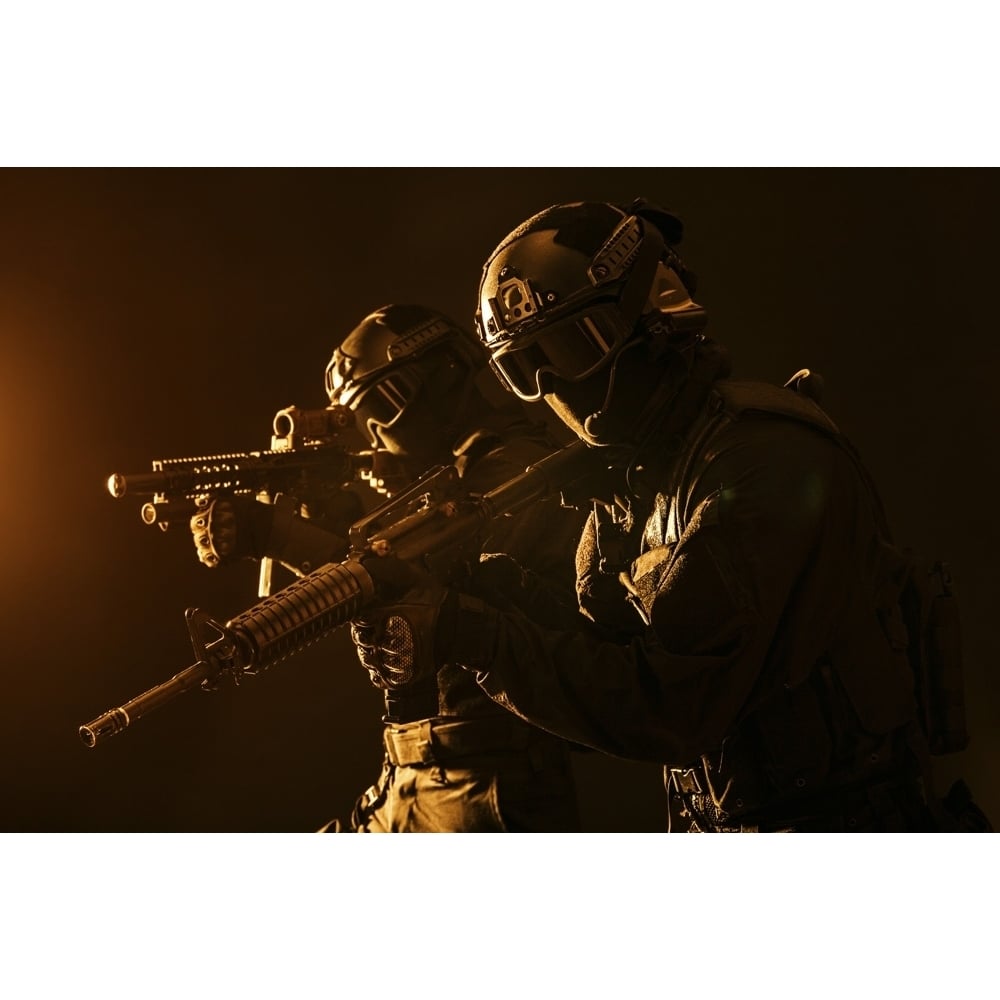 Spec ops police officers SWAT in black uniform and face mask studio shot. Poster Print by Oleg Zabielin/Stocktrek Image Image 1