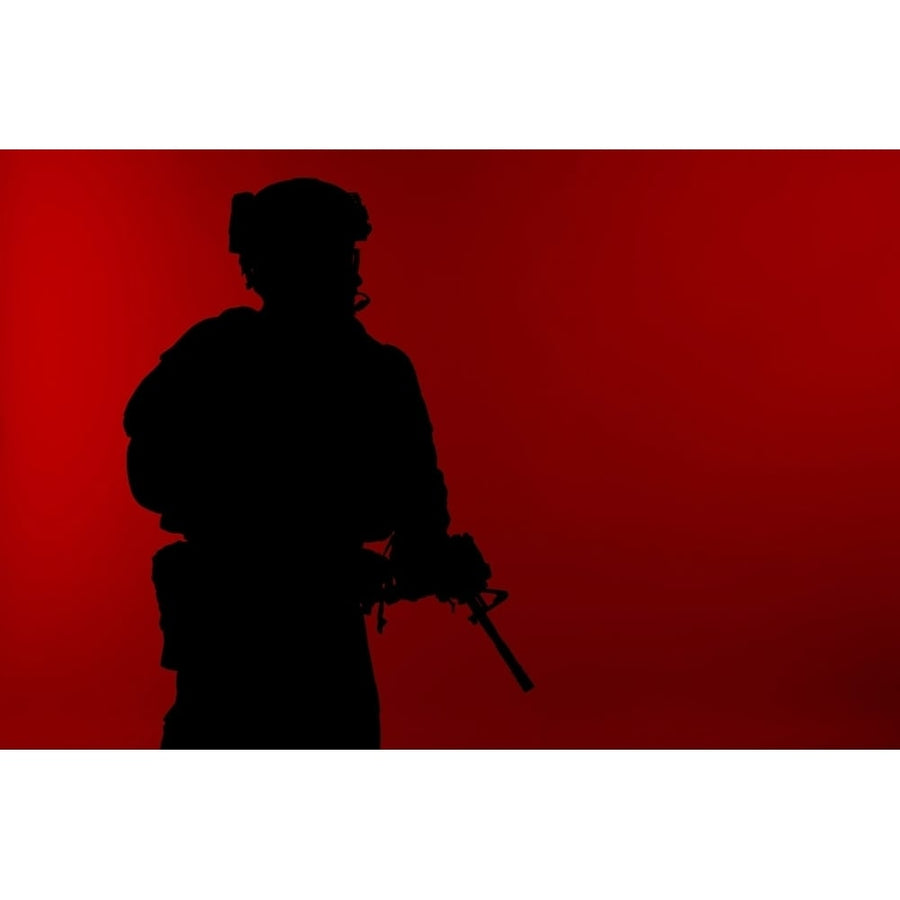 Silhouette of a U.S. Marine Corps Marsoc raider with weapon red background. Poster Print by Oleg Zabielin/Stocktrek Ima Image 1