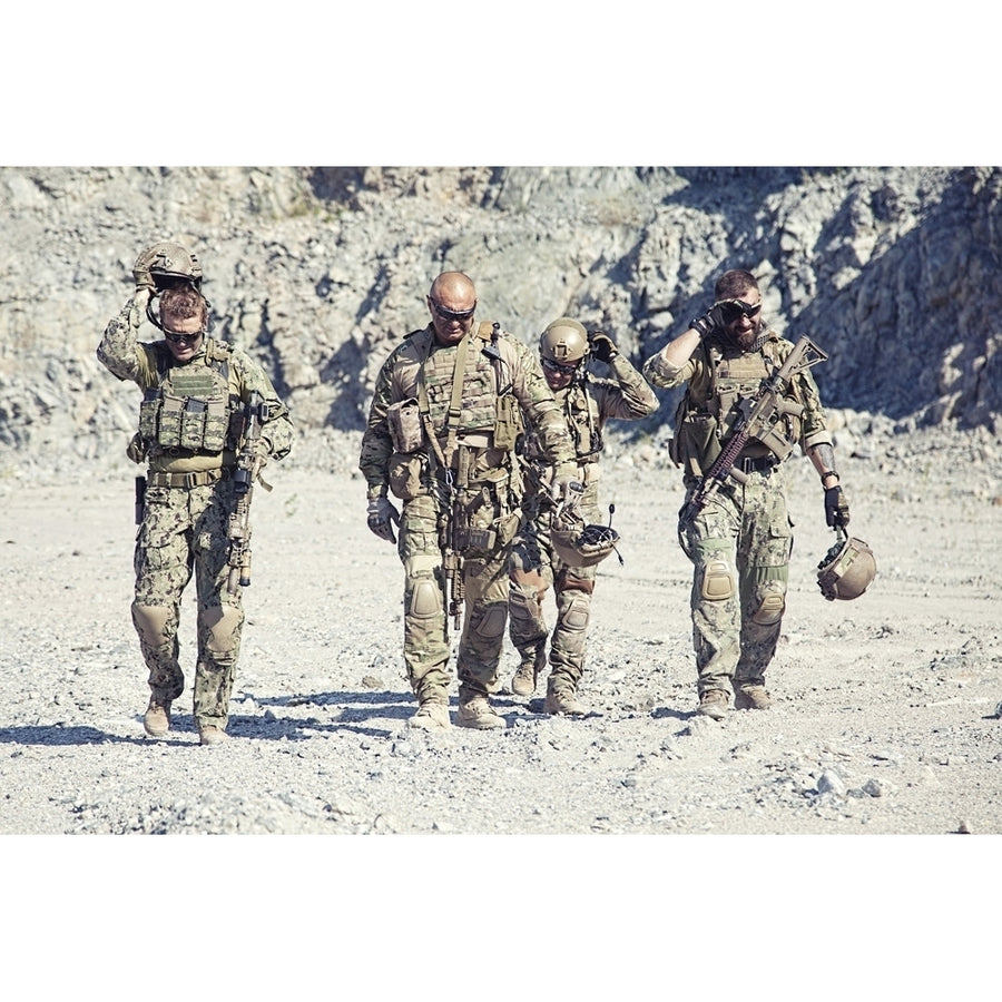 Squad of special forces in action in the desert. Poster Print by Oleg Zabielin/Stocktrek Images Image 1