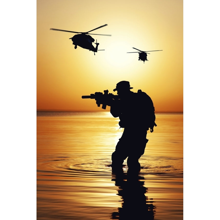 Silhouette of Army woldier with rifle at sunset during a raid crossing a river. Poster Print by Oleg Zabielin/Stocktrek Image 1