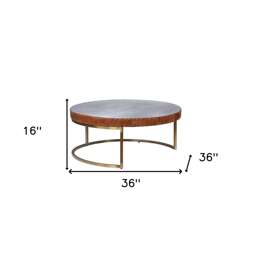 36" Brown And Silver Leather And Metal Round Coffee Table Image 2