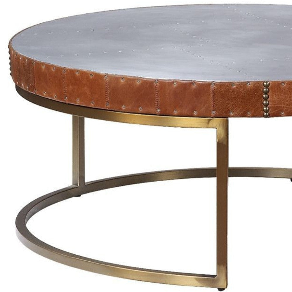 36" Brown And Silver Leather And Metal Round Coffee Table Image 4